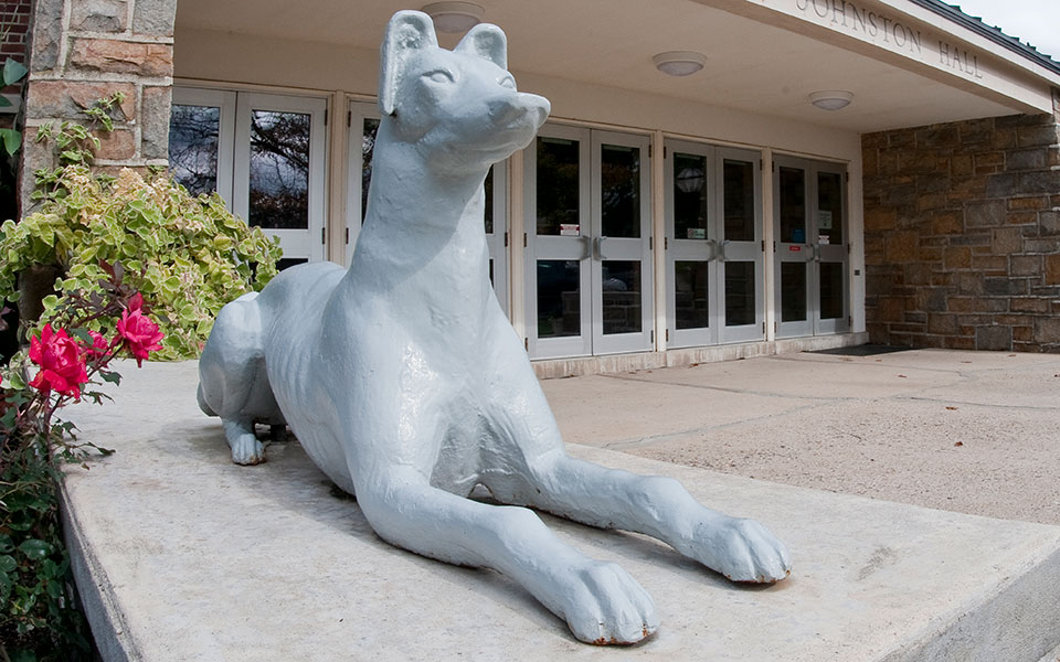Greyhound statue in front of johnston hall entrance
