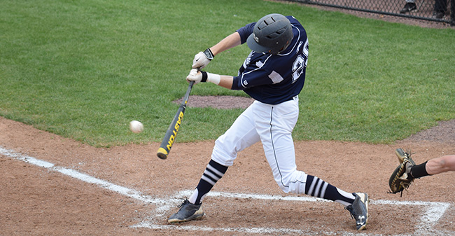 Tim Heard '19 hits a pitch at Gillespie Field during the 2017 season.