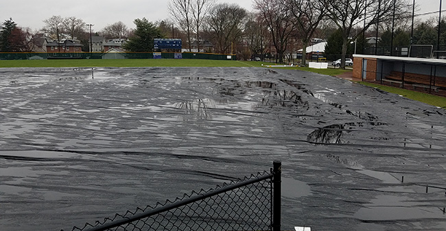 Gillespie Field under its new full infield tarp.