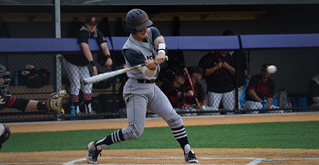 Chase Rogers '19 connects on a single during the Landmark Conference Tournament opener versus The Catholic University of America at Scranton.