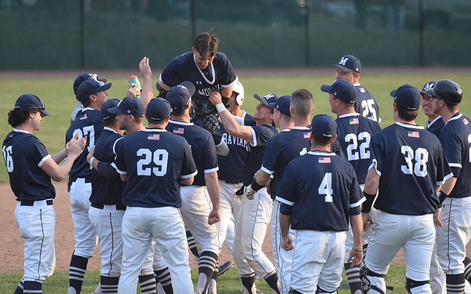 The Greyhounds celebrate after sophomore Michael Miceli scores the winning run in an 11-inning walk-off victory over Susquehanna University at Gillespie Field.