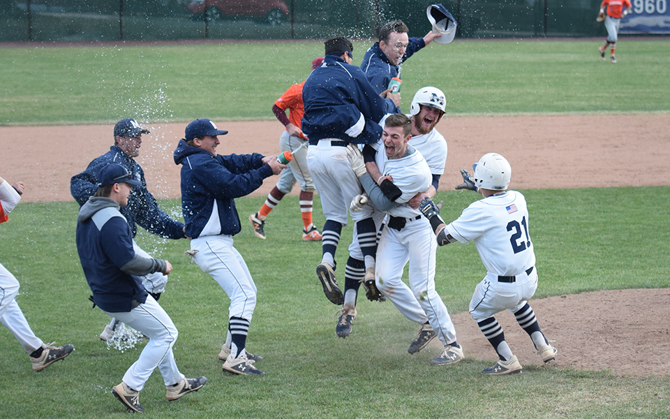 The Greyhounds race toward freshman AJ Brosious to celebrate after his RBI sacrifice fly gave the Hounds a 7-6, 13-inning walk-off win over Susquehanna University at Gillespie Field.