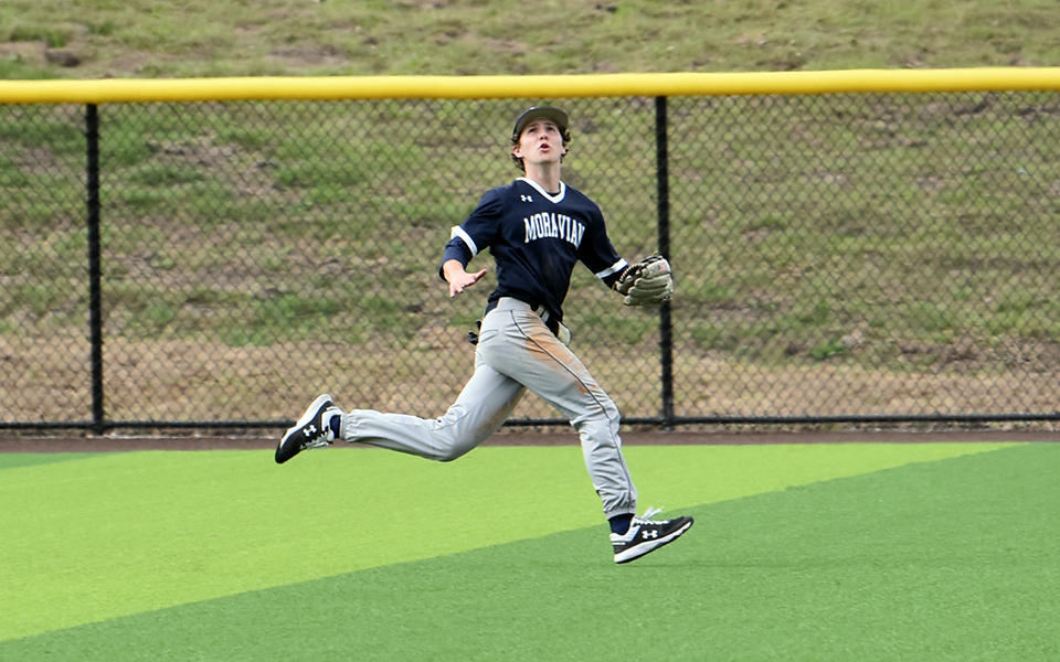 Sophomore outfielder Matt Madigan tracking down a ball hit in the outfield in Davenport, Florida.