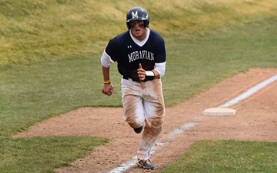 Junior Derek Holmes heads home from third base in a game versus Juniata College at Gillespie Field in March 2022. Photo by Nadia Hassanali '22