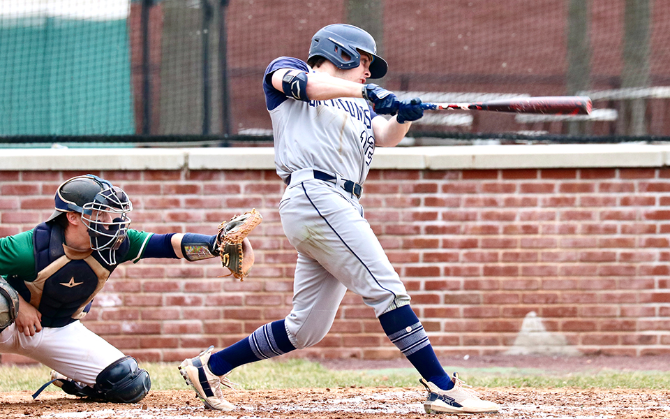 Junior center fielder Patrick Benolken connects with a pitch in the 2023 Landmark Conference opener at Drew University. Photo by Entrophy Sports Photography / Bob Koch