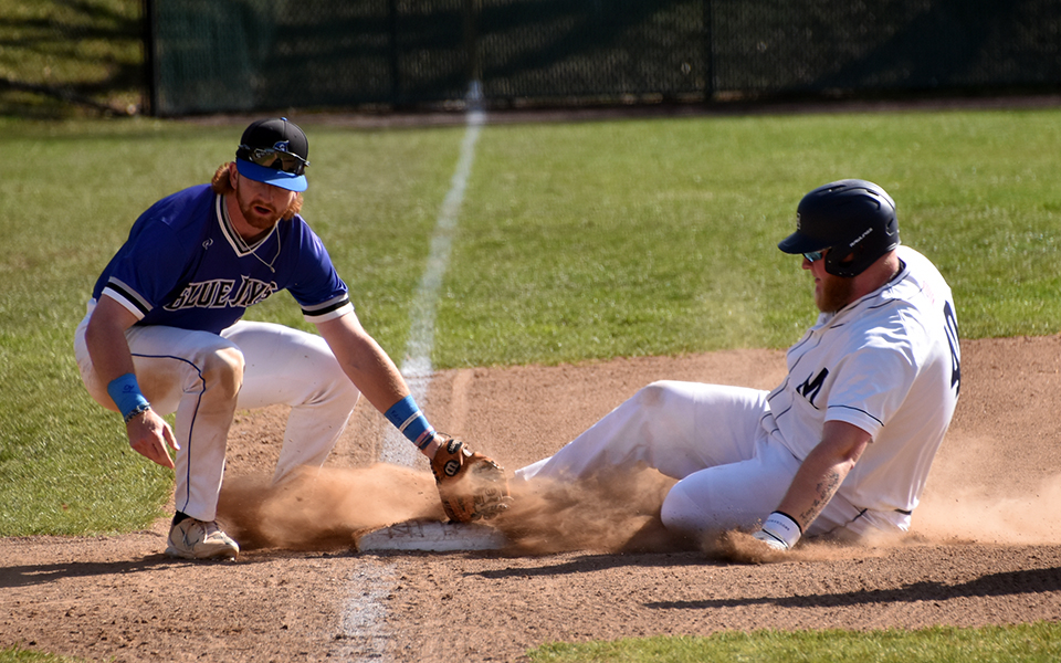 Junior Cole Cherkas slides into third with a triple in the second game of a doubleheader versus Elizabethtown College at Gillespie Field. Photo by Marissa Williams '26
