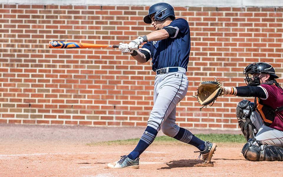 Senior Mason Fisher connects on a hit versus Susquehanna University at Gillespie Field earlier this season. Photo by Cosmic Fox Media / Matthew Levine '11