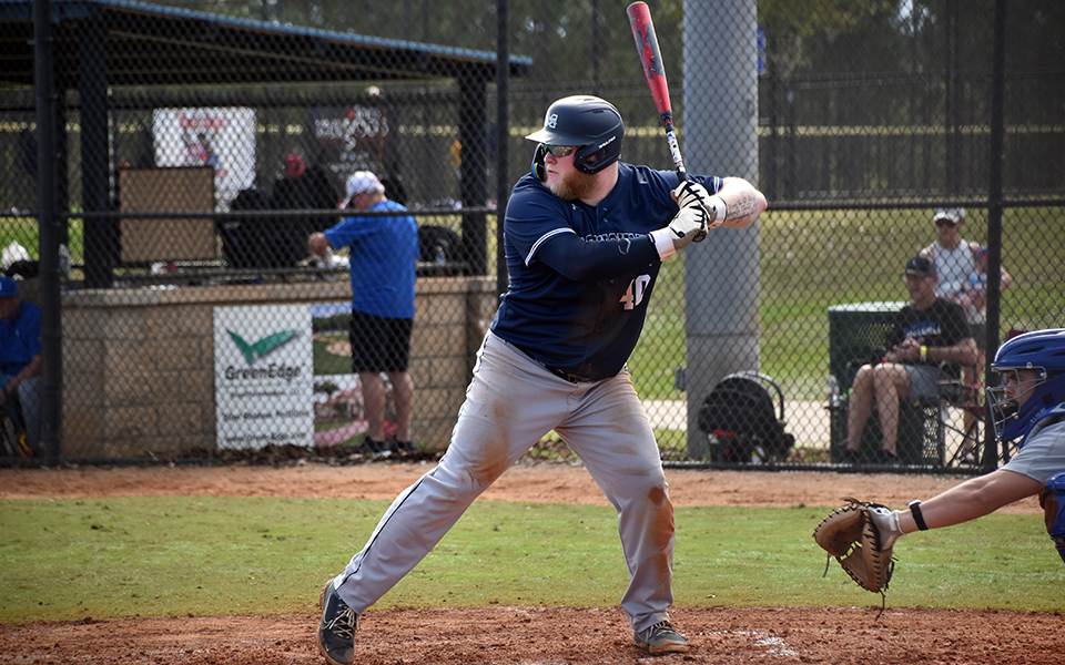 Senior designated hitter Cole Cherkas in the batter's box before hitting a solo home run versus Illinois College in the RussMatt Invitational at Lake Myrtle Park in Florida. Photo by Christine Fox