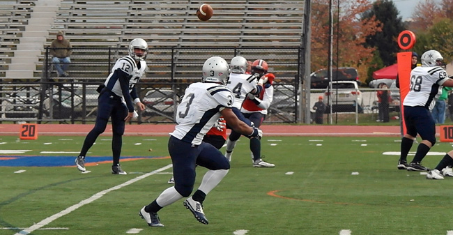Sophomore quarterback Mike Hayes throws an 11-yard touchdown pass to sophomore running back early in the second quarter of the Greyhounds' 34-14 Centennial Conference win at Gettysburg.