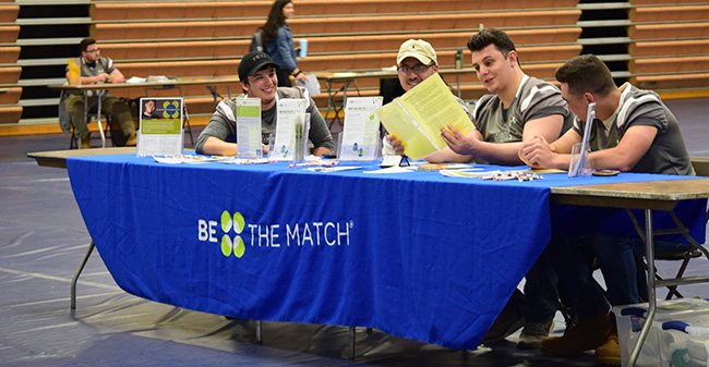 Members of the Moravian football team ready to help people begin the registration process in the 9th Annual Be The Match Bone Marrow Donor Registration Drive.