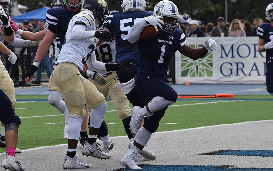 Senior Eli Redmond gets into the end zone against Juniata College on Homecoming shortly after becoming the 11th player in school history to reach 2,000 career rushing yards.