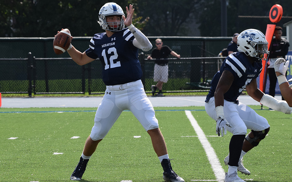 Freshman quarterback Christopher Mills attempts a pass early in the first quarter of his first collegiate start versus Gettysburg College.