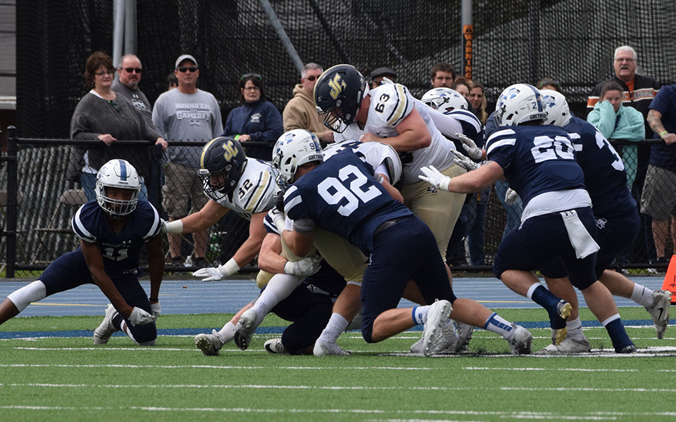 The Greyhounds' defense makes a stop on a running play versus Juniata College at Rocco Calvo Field.