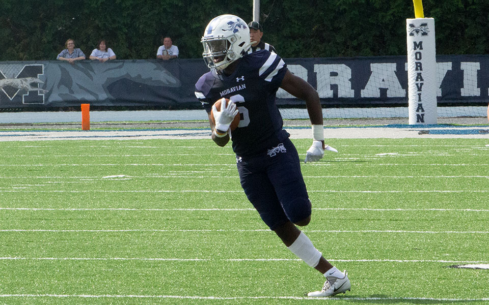 Romello Walters returns an interception for a touchdown in a game versus Ursinus College on Rocco Calvo Field during the 2019 season.