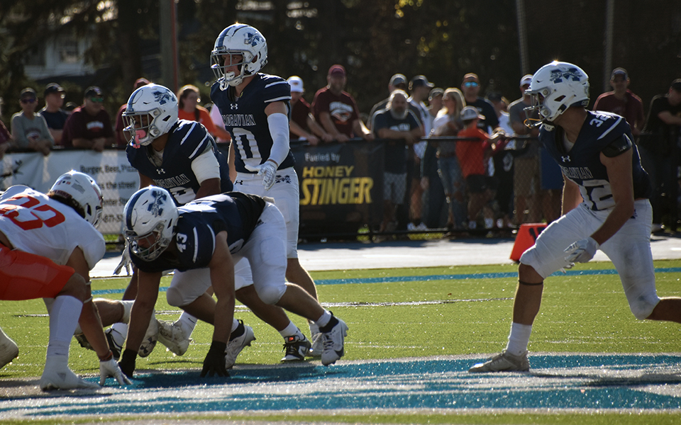 The Greyhounds' defense gets set for a play late in the game versus No.11 Susquehanna University at Rocco Calvo Field this season. Photo by Avery Saladino '24