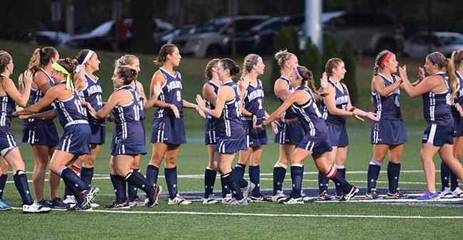 The Greyhounds prepare for the starting lineups against Bryn Mawr College.