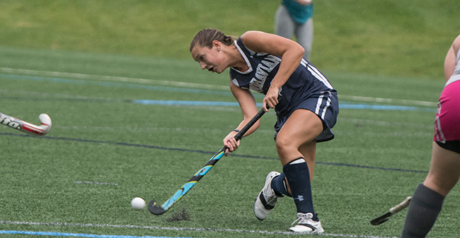 Olivia Schlofer '20 puts the ball into the circle in a match versus Sweet Briar College.