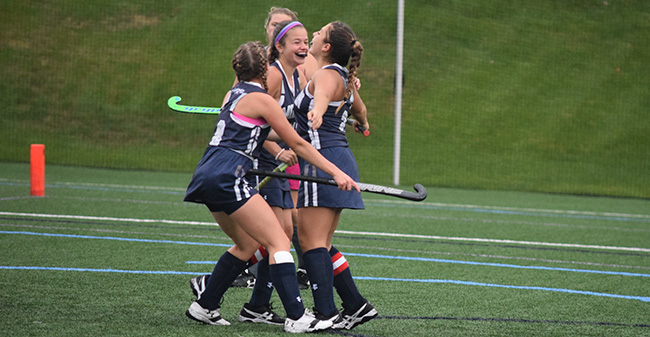 The Greyhounds celebrate a goal versus Sweet Briar College.