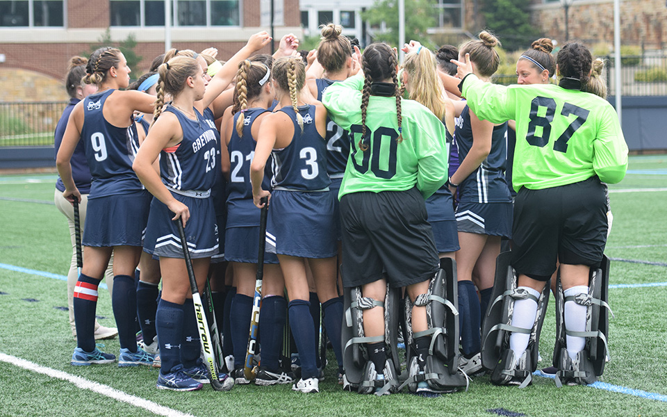 The Greyhound huddle before a match versus Ramapo College of New Jersey this season.