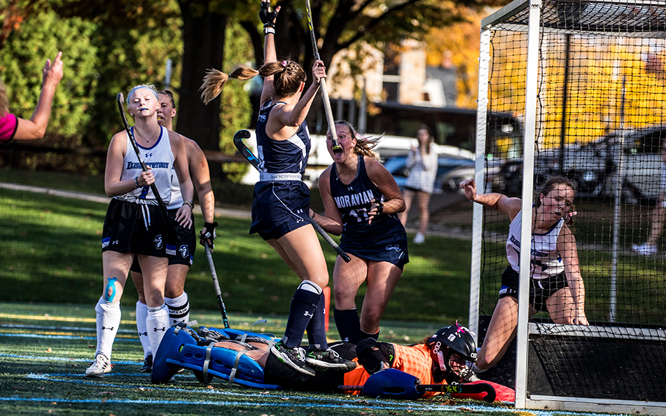 Junior forward Sydney Anderson and senior defender Onalee Long celebrate Anderson's double-overtime goal versus Elizabethtown College in the Landmark Conference Tournament First Round on John Makuvek Field. Photo by Cosmic Fox Media / Matthew Levine '11