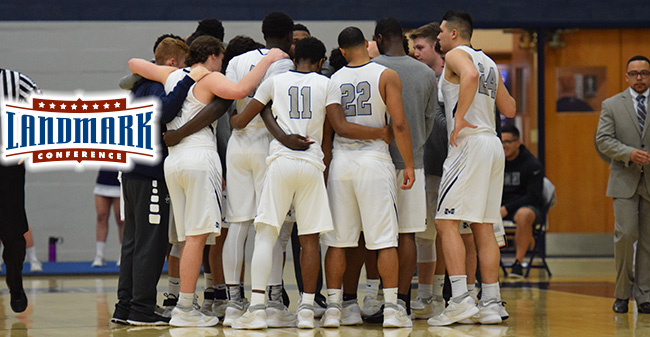 The Hounds huddle before tip-off of the Landmark Conference Semifinals versus Susquehanna University in February 2017.