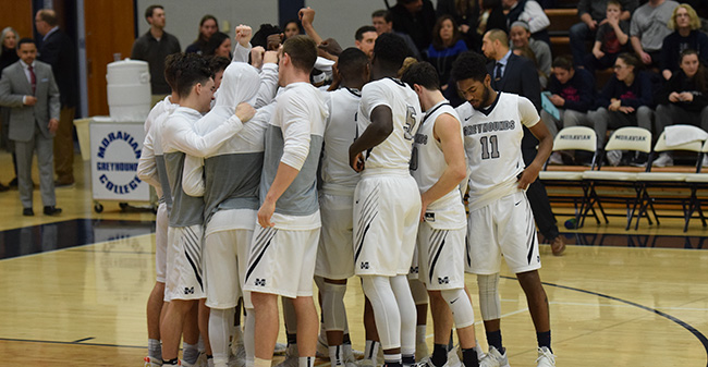 The Hounds get ready for tip-off versus Juniata College earlier this season.