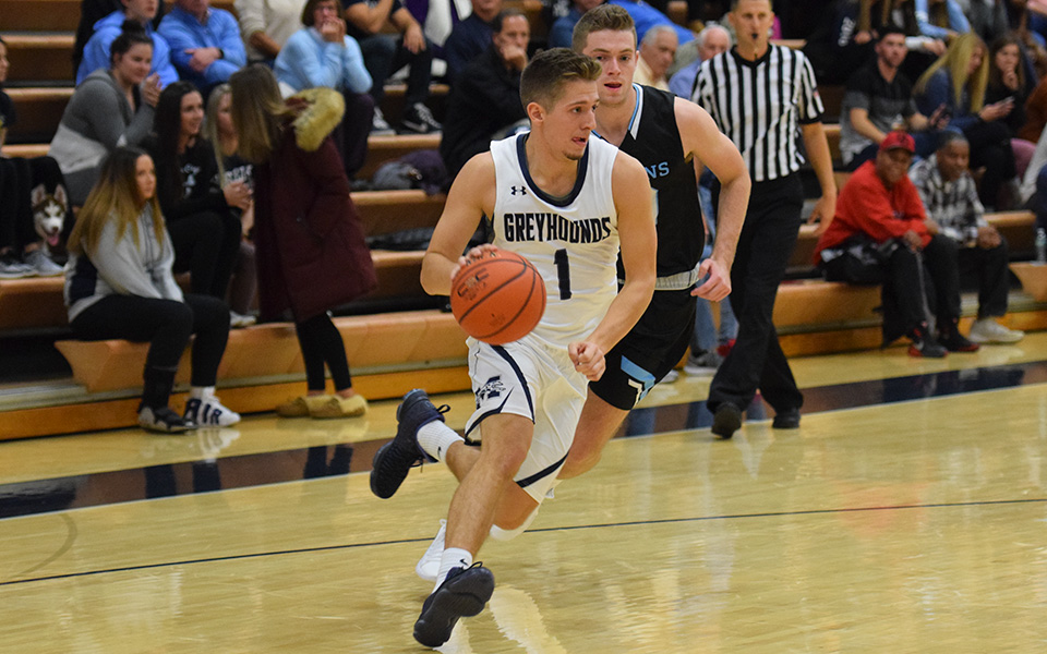 Sophomore guard Keith Otto drives down the baseline versus No. 15 Johns Hopkins University in Johnston Hall.