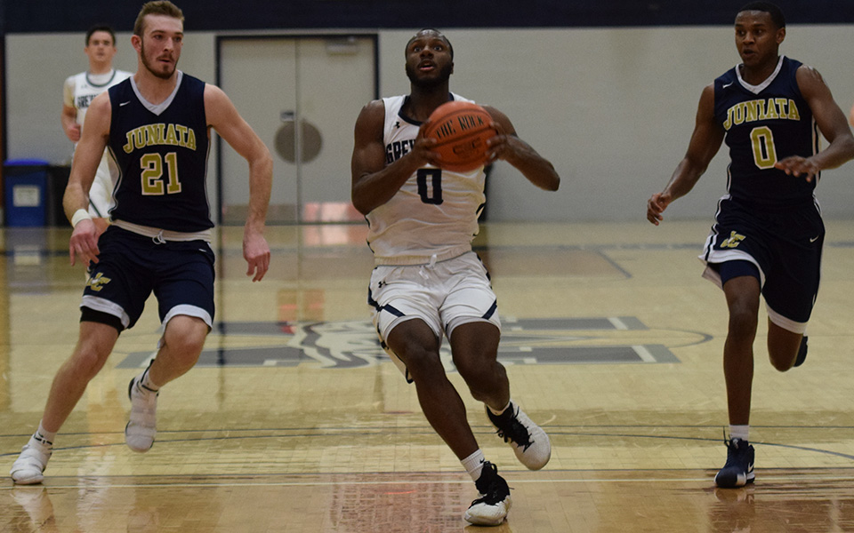 Junior forward John Hargraves goes down the lane for a lay-up in the second half versus Juniata College in Johnston Hall.