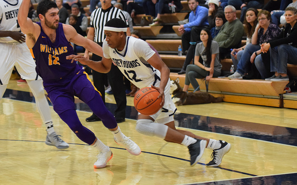 Elijah Davis dribbles down the baseline in a game versus No. 2 Williams (Mass.) College in Johnston Hall in December 2018.