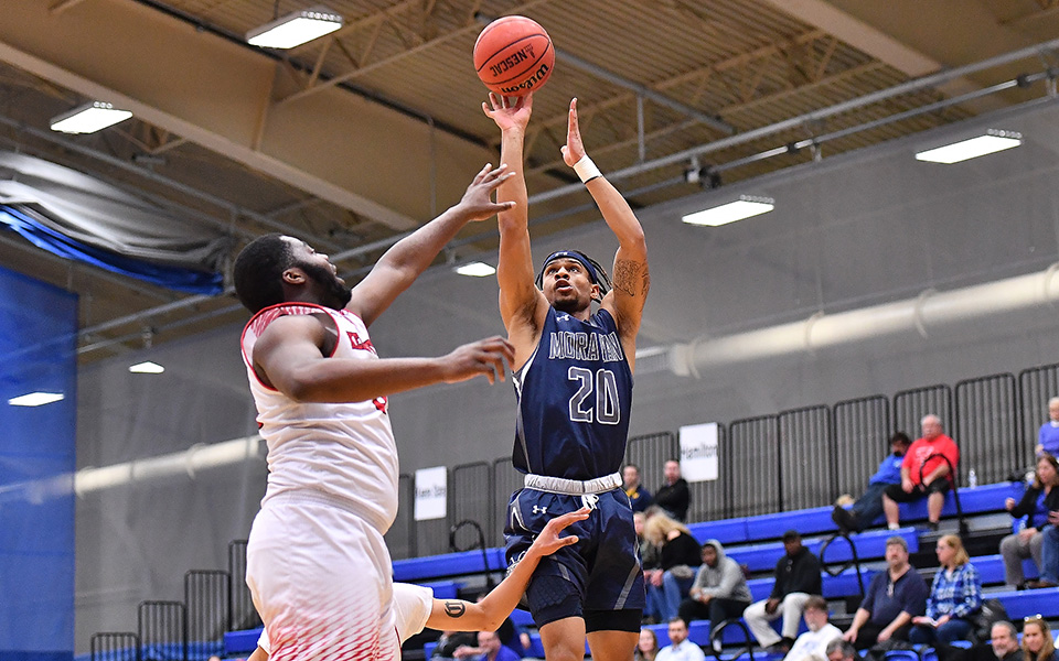 Junior guard C.J. Barnes takes a jumper during the second half of the NCAA Division III First Round game versus Keene State (N.H.) College at Hamilton (N.Y.) College. Photo by Josh McKee
