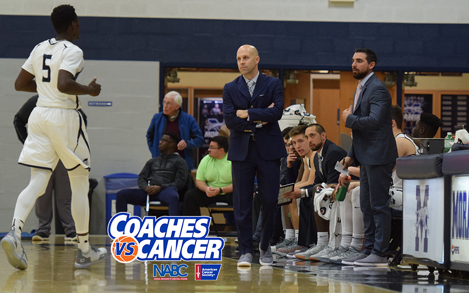 Men's Basketball staff wearing sneakers in support of Coaches vs. Cancer Suits and Sneakers Week.
