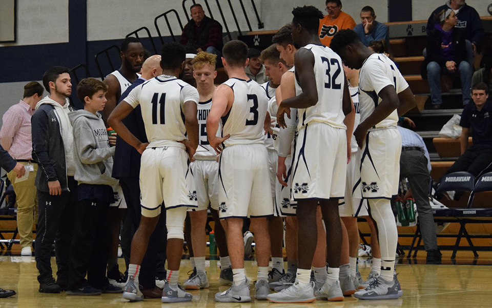 The Greyhounds talk during a timeout in a non-conference contest versus Marywood University in Johnston Hall in December 2018.