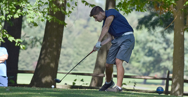 Victor Tavares '21 tees off on the ninth hole at Southmoore Golf Course in the Moravian Fall Invitational.