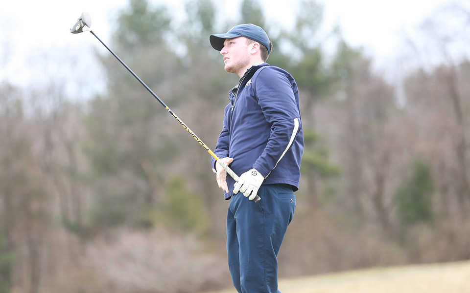 Senior Kody Long watches a shot during the Alvernia University Invitational at the LedgeRock Golf Club. Photo courtesy of Alvernia Athletic Communications.
