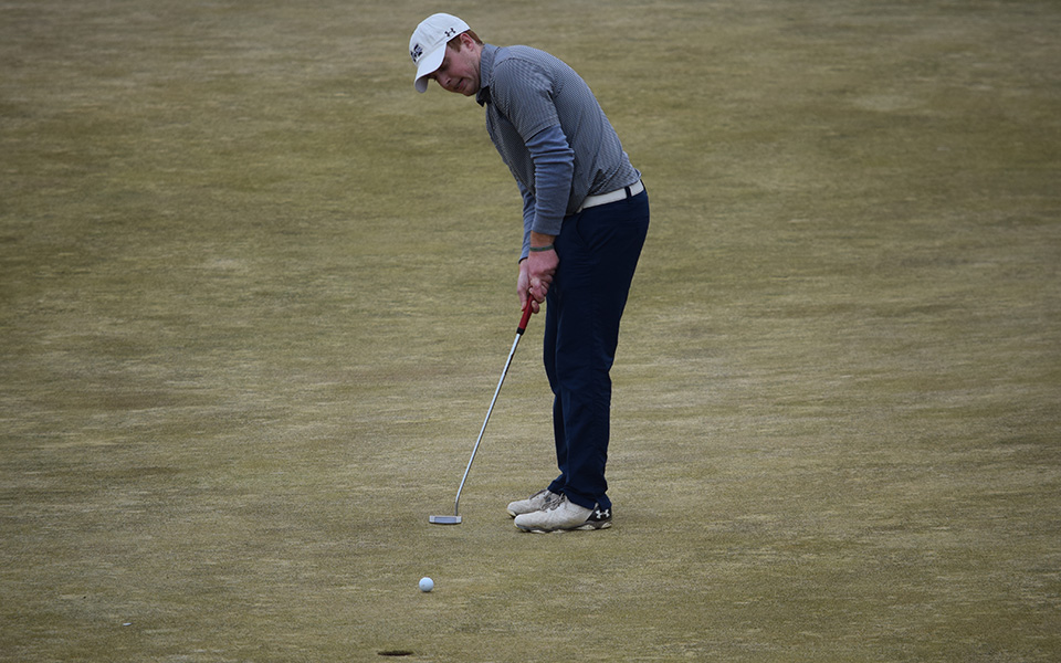 Nick Kuhn putts during the 2018 Moravian Spring Invitational at Southmoore Golf Course