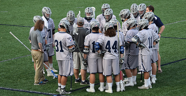 The Greyhounds huddle during a timeout in the 2017 season.