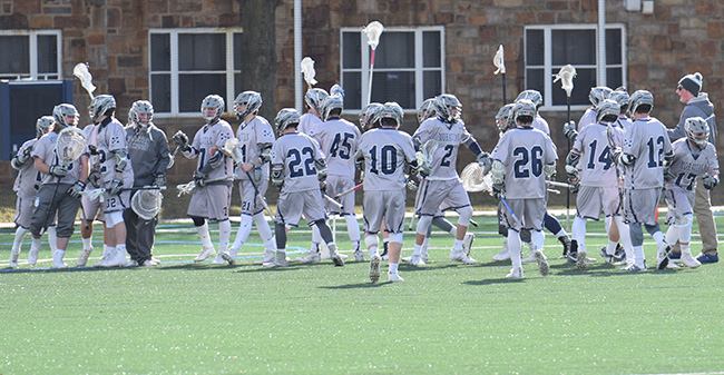The Greyhounds celebrate a win to begin the 2017 season versus Bryn Athyn College.