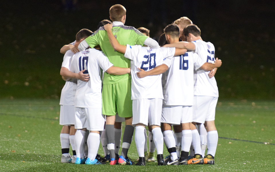 The Hounds huddle before the start of a match versus DeSales University on John Makuvek Field in October 2017.