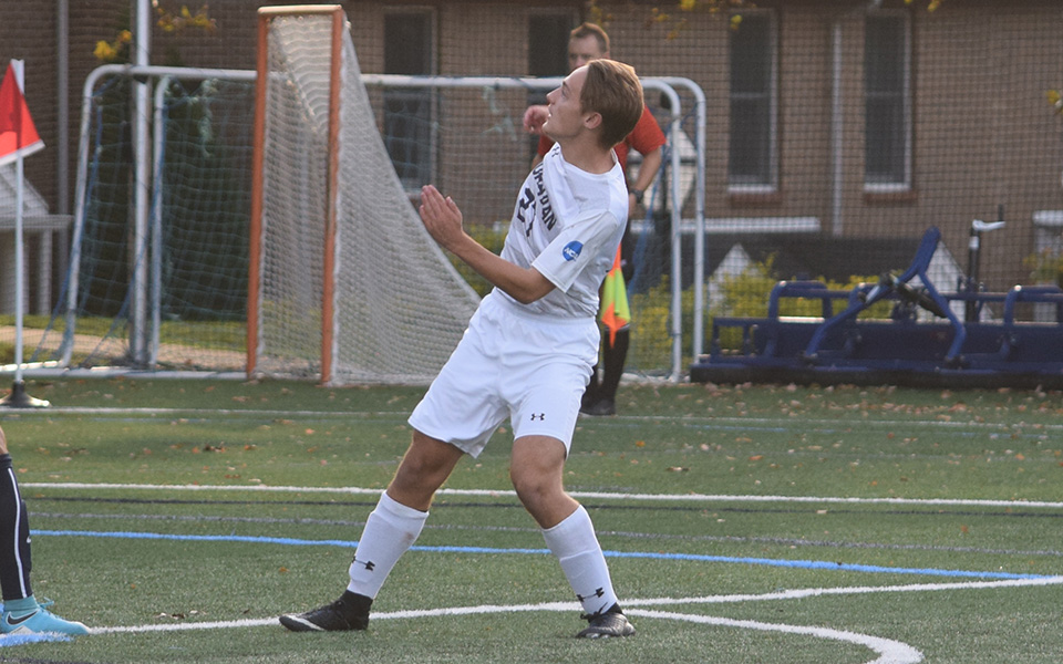 Ethan Blakely waits to head the ball during a match versus Juniata College in October 2017.
