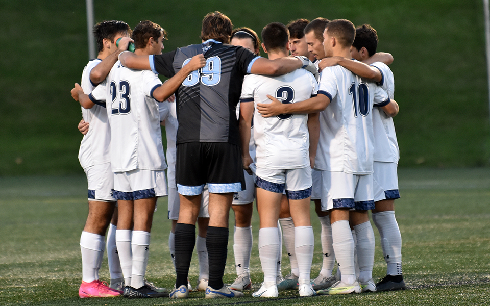 The Greyhounds huddle before starting a non-conference match with Widener University on John Makuvek Field.
