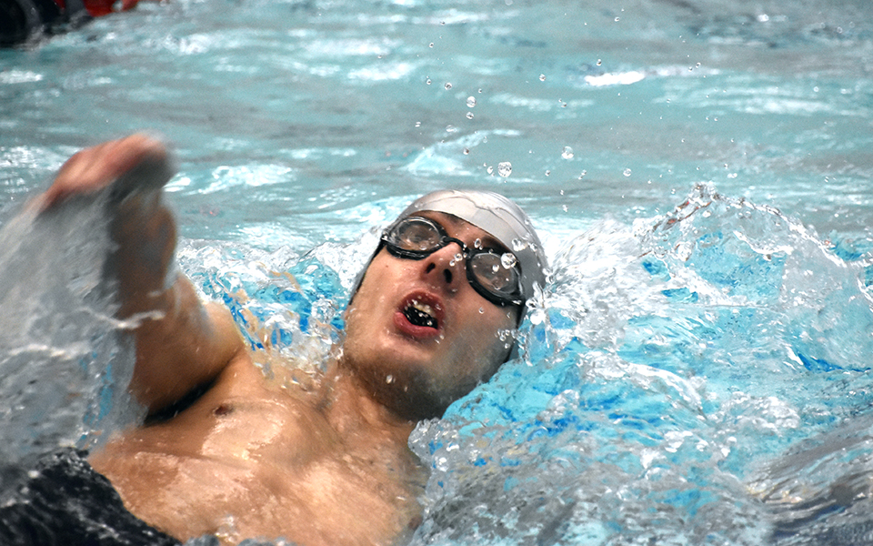 Freshman Evan Bulette swims in the 100-yard backstroke in a dual meet with Marywood University at Liberty High School's Memorial Pool.