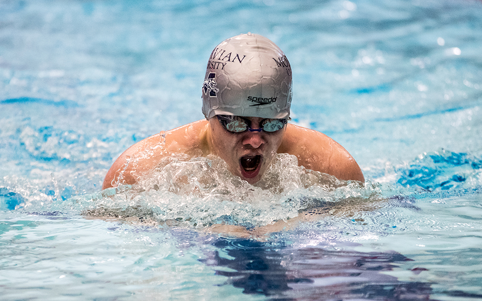 Freshman Jeffery Eisenhardt competes in the breaststroke in a double dual meet with Goucher College and Susquehanna University at Liberty High School's Memorial Pool earlier this season. Photo by Cosmic Fox Media / Matthew Levine '11
