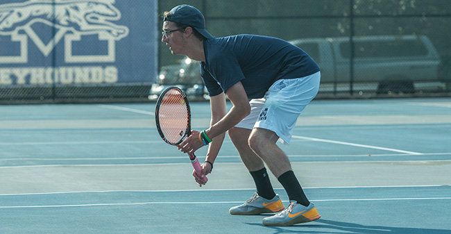 Mike Palmeri '18 awaits a serve in doubles action versus DeSales University in September 2017 on Hoffman Courts.