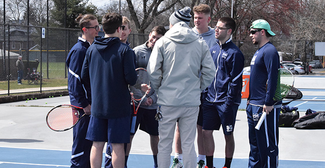 The Greyhounds discuss strategy before a match with Susquehanna University at Hoffman Courts.