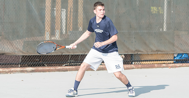 Peter Demyan '19 returns a shot during a match on Hoffman Courts in the fall of 2017.