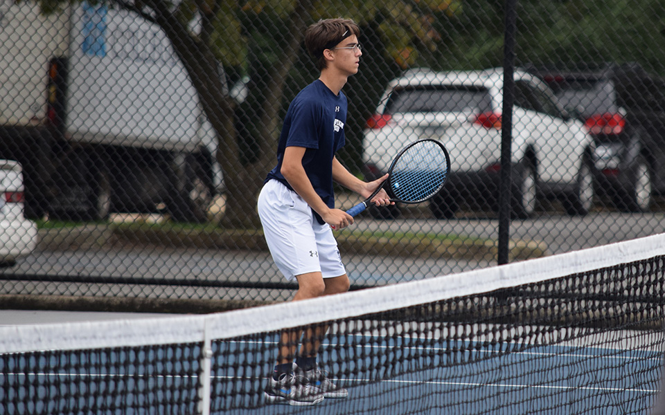 Neil Guarino waits for a shot in doubles action versus Muhlenberg College at Hoffman Courts.