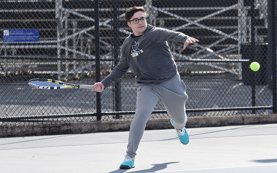 Senior Isaac Schefer returns a shot during doubles action versus Delaware Valley University at Hoffman Courts.