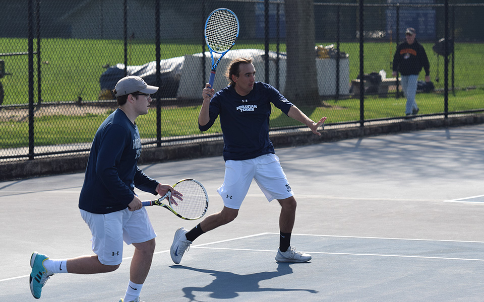 Senior Isaac Schefer and freshman Daniel Salimnejad in singles action versus Neumann University at Hoffman Courts.