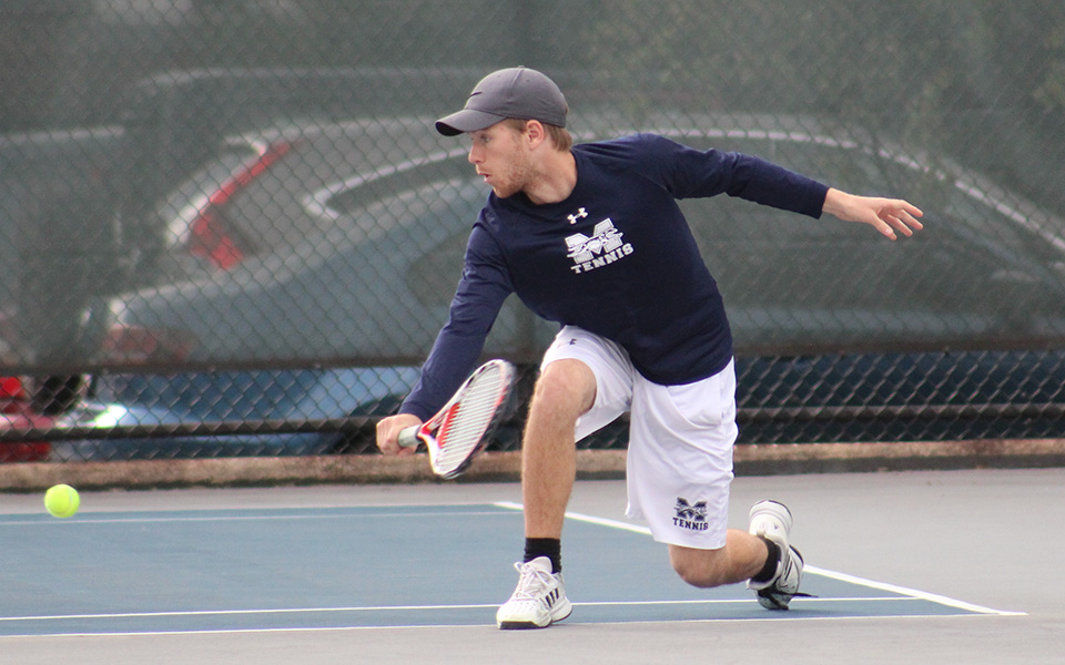 Sophomore Mason Hudnall returns a shot during doubles action versus Eastern University on Hoffman Courts.