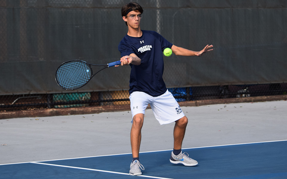 Neil Guarino returns a shot in doubles action versus FDU-Florham at Hoffman Courts.